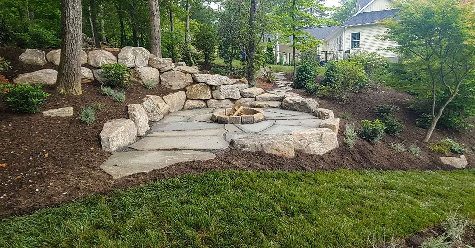 Natural Stone Retaining Walls and Fire Pit Design